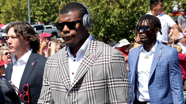 Arkansas Razorbacks quarterback KJ Jefferson (center) during the Hog Walk outside of the stadium prior to the game against the Kent State Golden Flashes at Donald W. Reynolds Razorback Stadium.